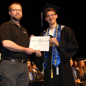  Student receiving certificate.